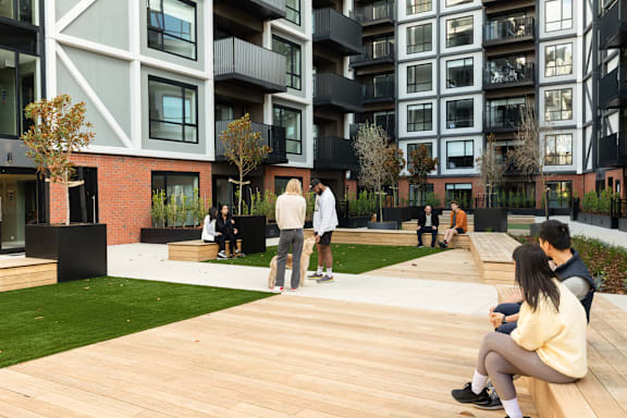 a rendering of a city street with trees and plants