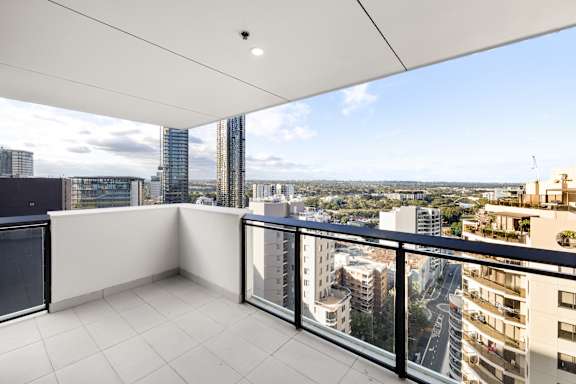 A balcony with a view of the cityscape.