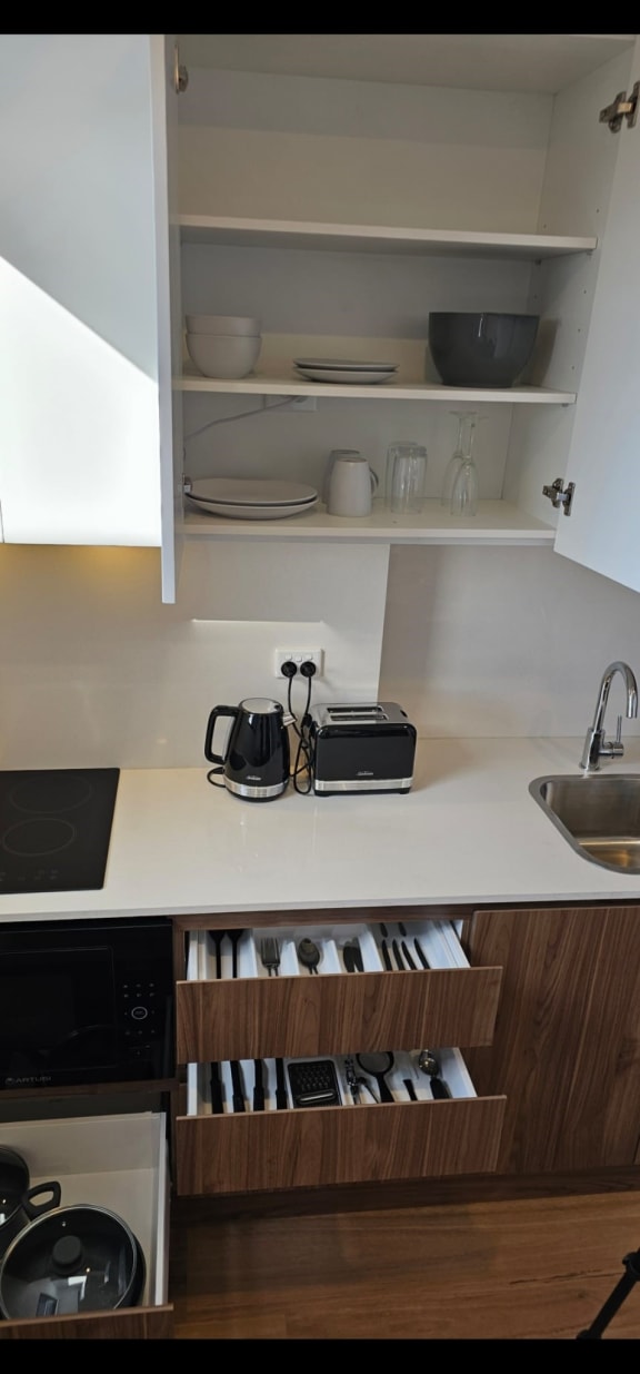 a kitchen or kitchenette with a sink and a counter top