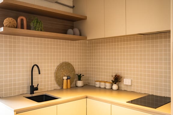 a kitchen with a sink and a counter top