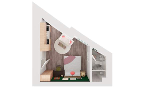 A dollhouse with a white wall and a small bed with a pink pillow.