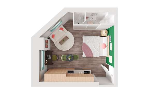 A small room with a bed, desk, and chair.