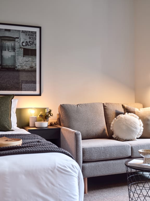 a living room with a couch and a bed