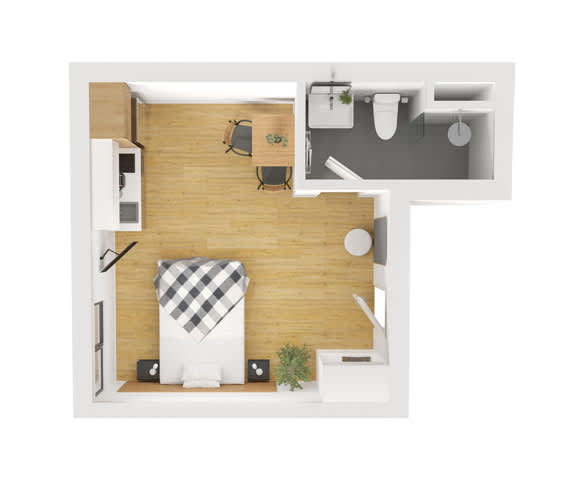 A small room with a bed, a desk, and a chair.