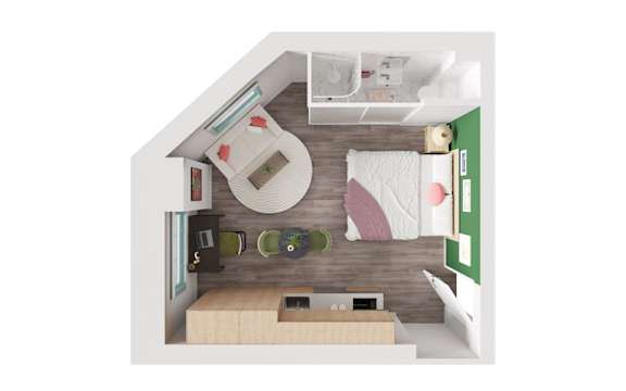 A small room with a bed, desk, and chair.