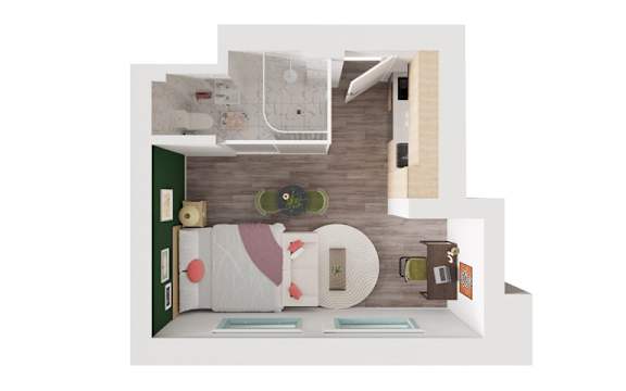 A modern living room with a grey sofa and a wooden floor.