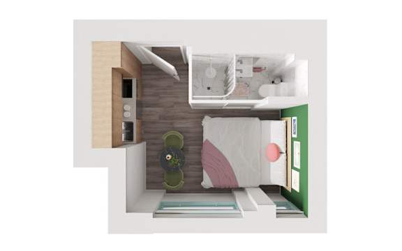 A small room with a bed, a desk, and a chair.