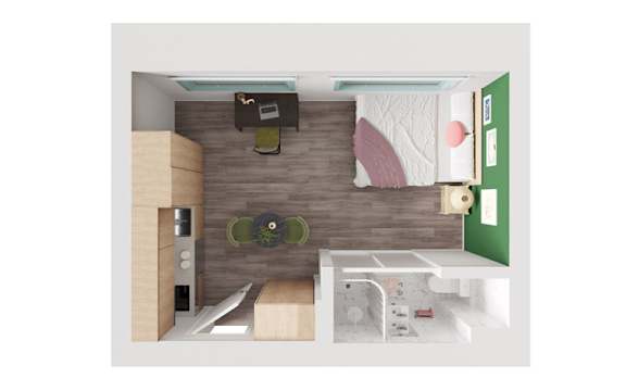 A small room with a bed, desk, and a chair.