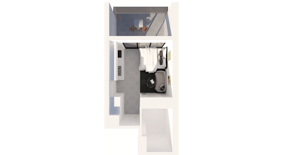 A white chair is placed in front of a small table with a black bag on it.