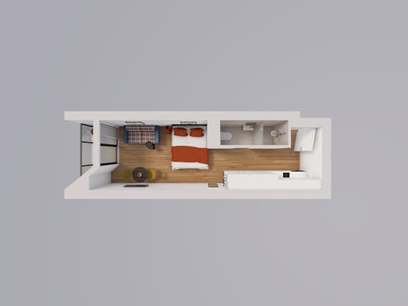 A top-down view of a modern, minimalist living space with a white sofa, a wooden coffee table, and a kitchen area.