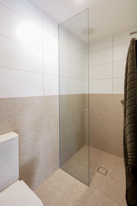a small bathroom with a shower and a toilet