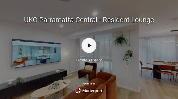 A living room with a television screen showing a resident lounge.