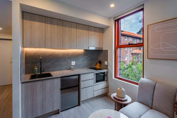 a kitchen with a sink and a window