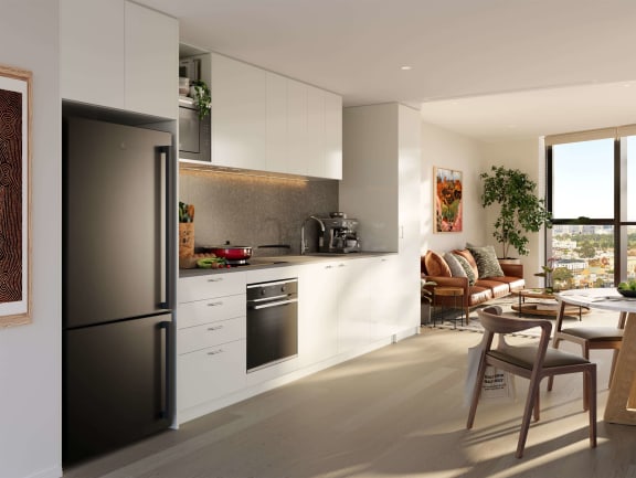 a kitchen and living room with a table and chairs