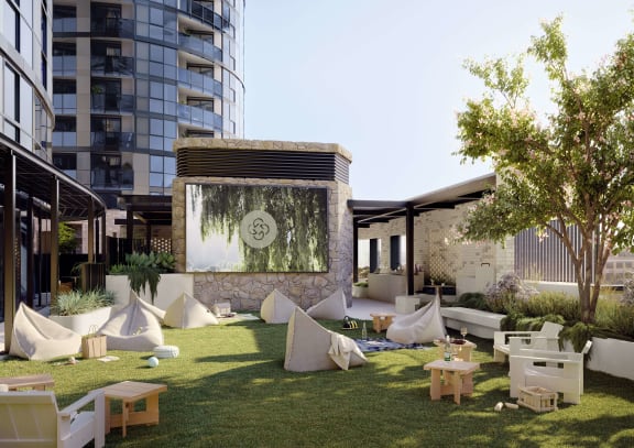 a rendering of an outdoor area with tables and a water fountain