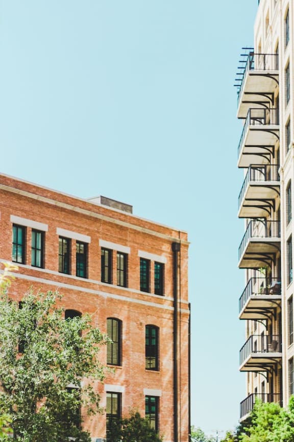 a brick building in front of a blue sky