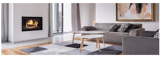 Large living room with modern sofas and fireplace