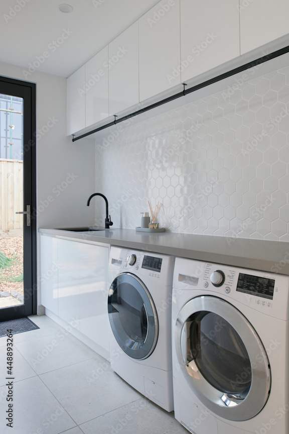 Alt: Washer and Dryer installed ina high end kitchen