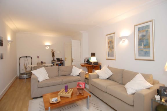 a living room with two couches and a coffee table