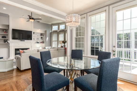 a living room filled with furniture and a large window