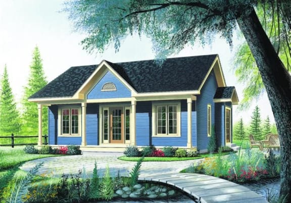 a blue house with a yard and a tree