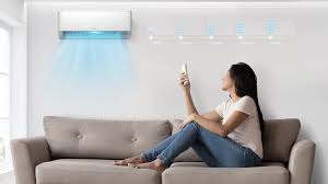 a woman sitting on a couch looking at her cell phone