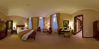 a large bedroom with a large bed and a large window