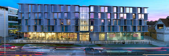a view of the front of the building at dusk