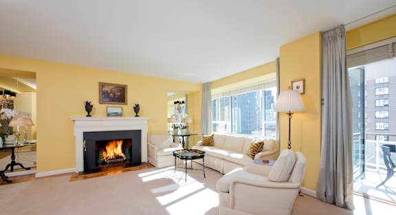 A living room with a fireplace and a couch.