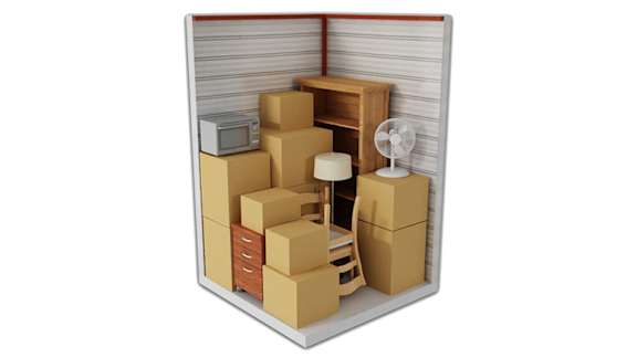 a room full of cardboard boxes and a fan