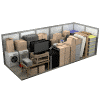 A pile of boxes and a television set on a table.
