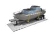 A small boat is being transported on a trailer.