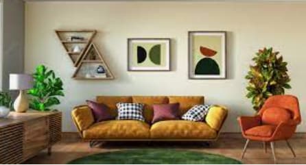 A living room with a yellow sofa and a green rug.