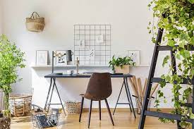 a home office with a desk and a chair