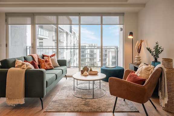 A living room with a couch, chair, and coffee table.