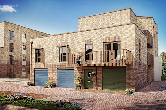 A modern brick building with a balcony and a green garage door.