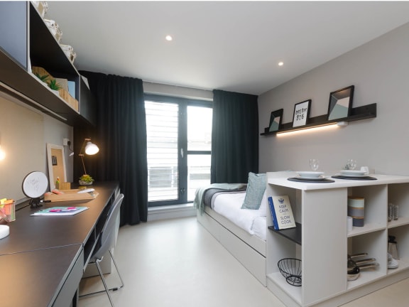 Floor Plan  a bedroom with a bed and a desk