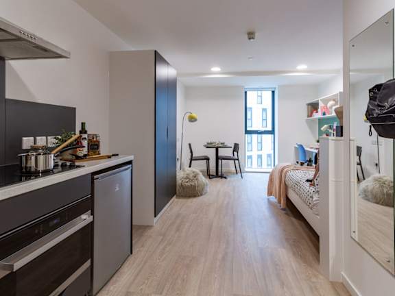 Floor Plan  A modern kitchen with a dining area and a bedroom.