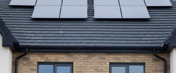 a house with a solar panel on the roof