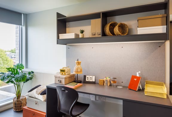 Floor Plan  a home office with a desk and a window