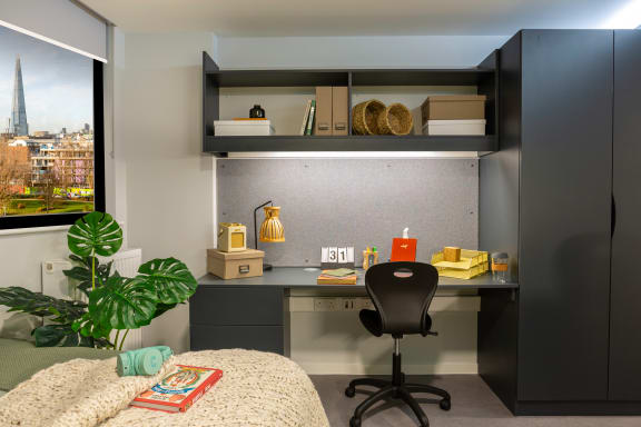 Floor Plan  a home office with a desk and a window