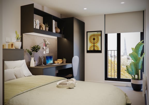 Floor Plan  a bedroom with a bed and a desk and a window