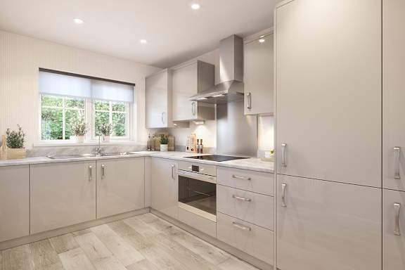 A modern kitchen with white cabinets and a wooden floor.