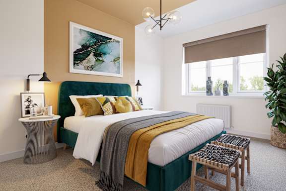 A bedroom with a large bed and a green headboard.