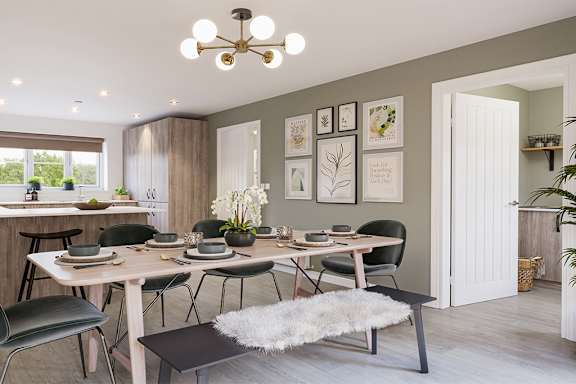 A dining room with a table set for six.