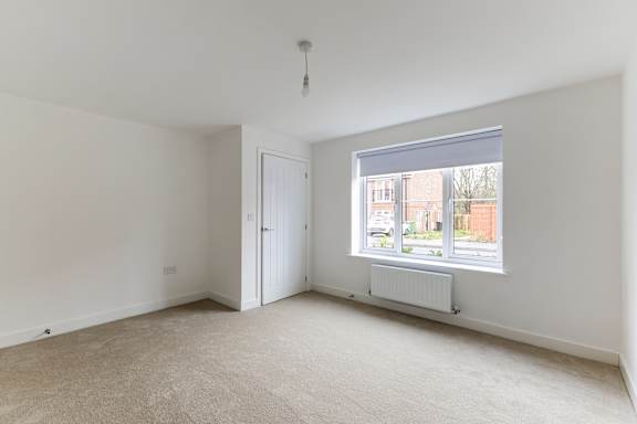 A room with a window and a door.