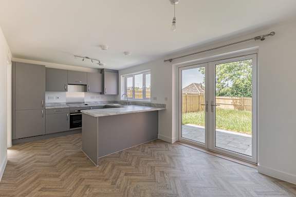 A kitchen with a large island in the middle of the room.