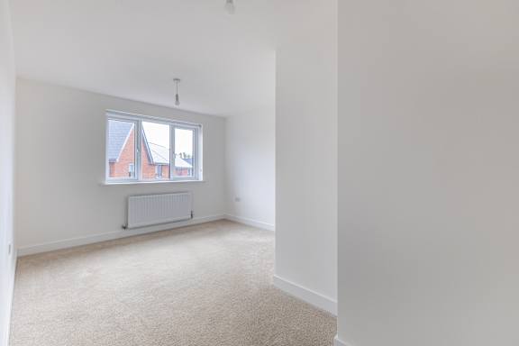 A room with a window and a radiator.