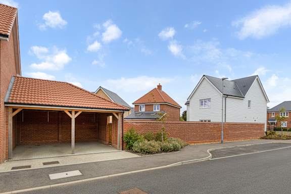 A residential area with houses and a clear sky.