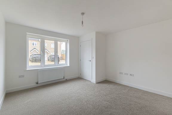 A room with a window and a door.